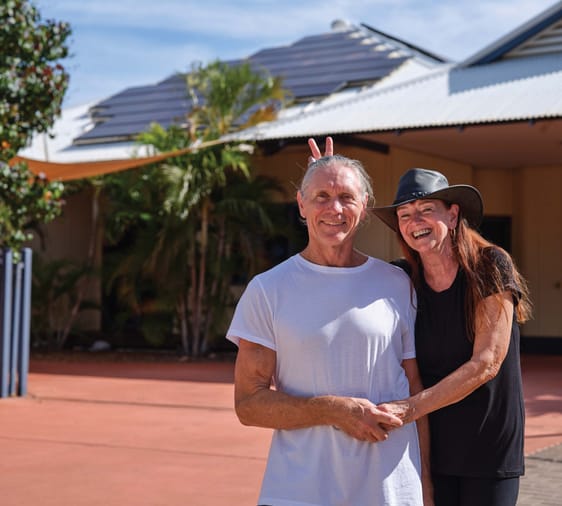 Regional WA couple smiling and waving